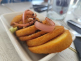 Lunch at the restaurant Chez Francine in Carro, featuring panisses (Marseille-style chickpea fritters); a restaurant facing the port of Carro, open year-round