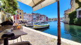 Lunch by the water on the quays of Martigues, with terrace seating along the canals or facing the Mediterranean Sea