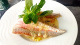 Homemade sea bream and vegetable dish prepared by Accadémia Caffé, located near the Miroir aux Oiseaux in Martigues