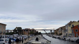 View of the Martigues canal in the heart of the historic center; a stroll along the canals and colorful facades reminiscent of Venice