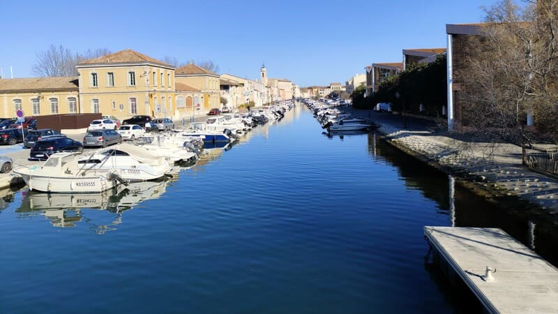 A canal in the heart of the Île district in Martigues, featuring boats, bridges, and colorful facades—classic Provençal scenery for a motorhome visit