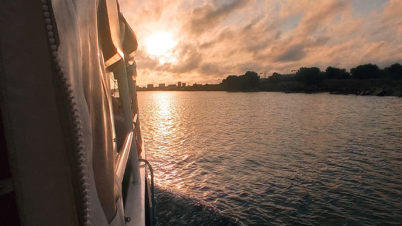 Motorboat in the open Mediterranean Sea at sunset from Martigues. Late afternoon sun, a moment of relaxation in Martigues. - © Otmartigues / MyriamF