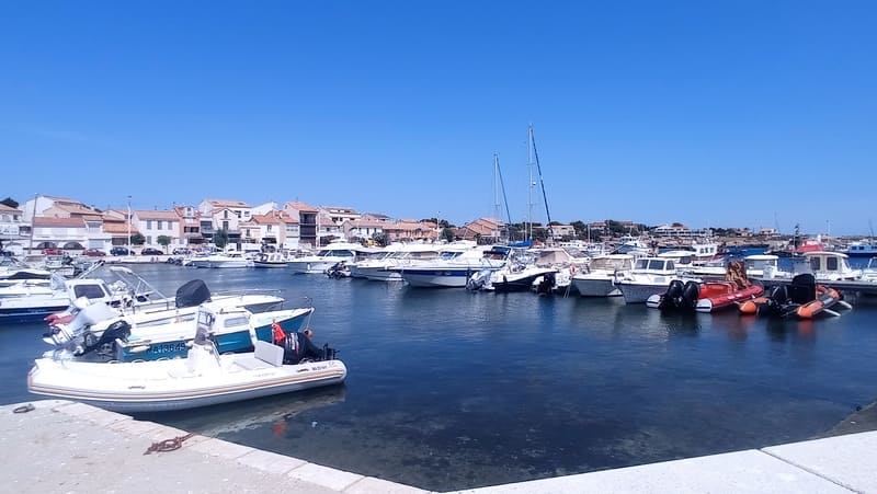 Port de Carro quay with motorboats moored among the traditional boats. The port is near the fish market every morning. - © Otmartigues / MyriamF