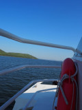 Photo taken from a boat next to a red lifebuoy. In the middle of the Etang de Berre with a view of the lagoons.