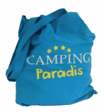 Bolso Tote azul con el logo blanco y amarillo de Camping Paradis en el centro