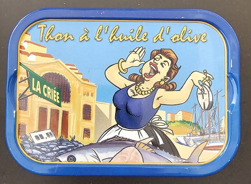 Can of tuna in olive oil from the Ferrigno brand. Original design highlighting the fish market in the South of France. Product available at the Martigues Tourist Office.